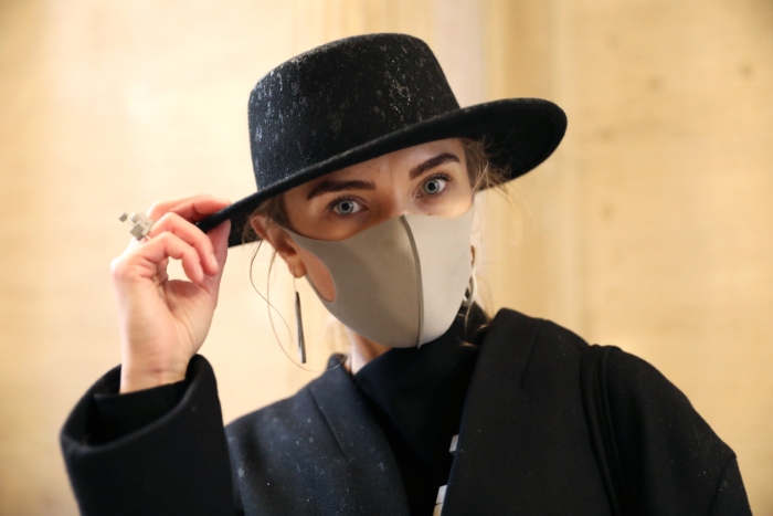 Gerda Liudvinaviciute, from Lithuania, wears a face mask and kARTu clothing during the Fashion Scout as part of the London Fashion Week February 2020 show at Victoria House, Bloomsbury, London. (Photo by Isabel Infantes/PA Images via Getty Images)