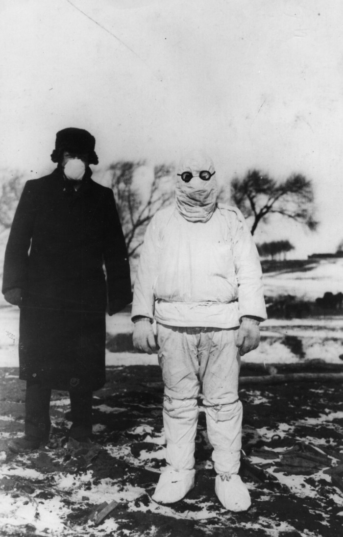 1912: A doctor wears protective clothing during an outbreak of plague in Manchuria. (Photo by Hulton Archive/Getty Images)