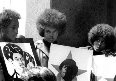 SAN FRANCISCO, CA - MAY 1: A group of women show their support for the Black Panther Party while holding signs with the picture of Minister of Defense Huey P. Newton on May 1, 1969 in San Francisco, California. (Photo by Robert Altman/Michael Ochs Archives/Getty Images)